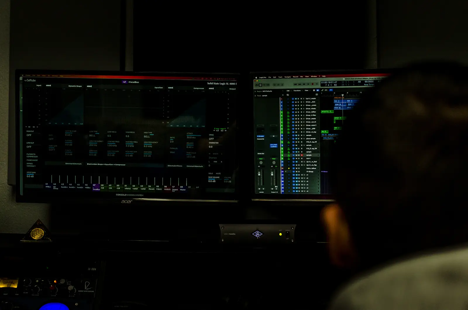 A producer monitoring audio on the 152 ENT studio screens during a session.